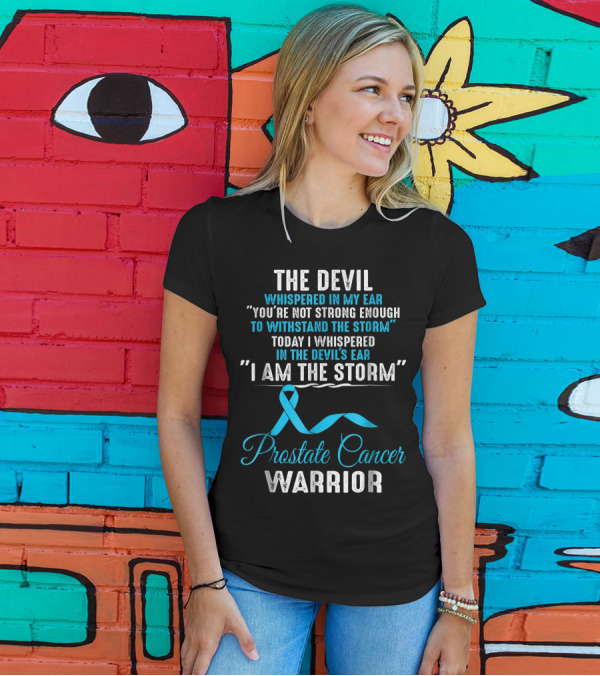 The Devil Whispered You’re Not Strong Enough To Withstand The Storm Prostate Cancer Warrior I Am The Storm T-Shirt