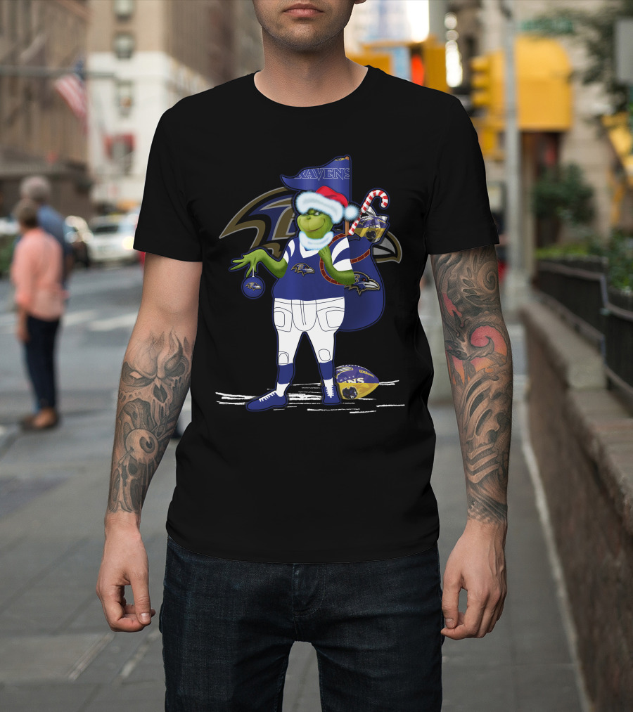 Grinch Santa Holding Candy Cane Bag and Baltimore Ravens Football in Ravens T-Shirt