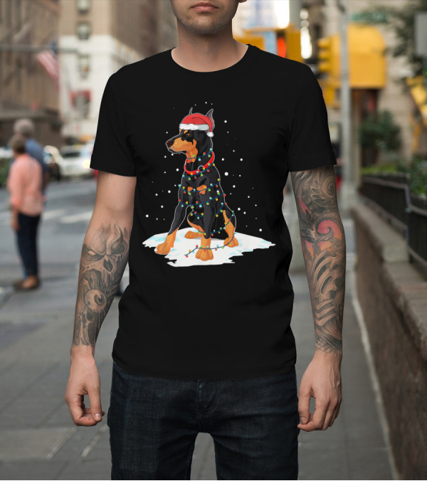 Shirt: Doberman Wearing Santa Hat Wrapped in Christmas Lights on Snow T-Shirt Doberman Wearing Santa Hat Wrapped in Christmas Lights on Snow T-Shirt