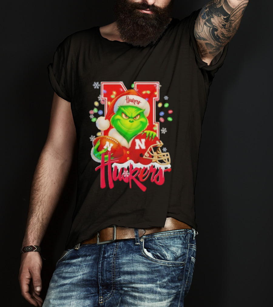 Grinch Santa With Nebraska Cornhuskers Helmet And Football Merry Christmas Huskers T-Shirt
