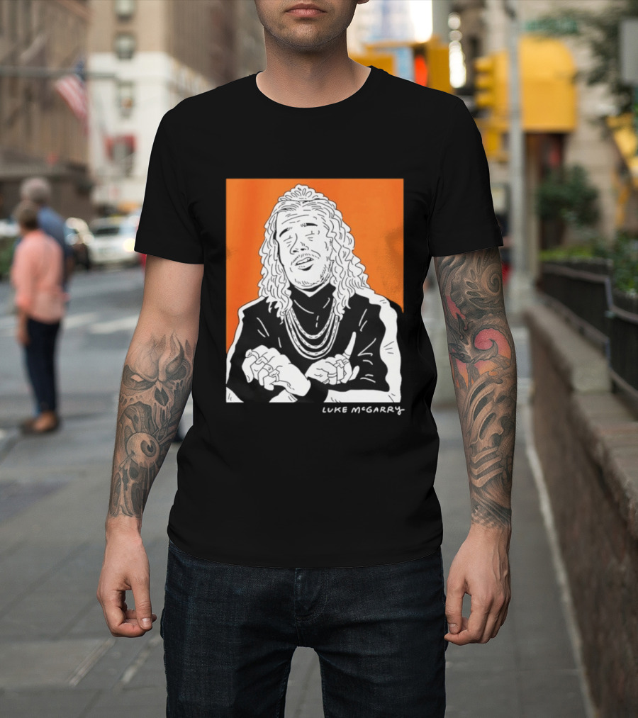 Luke McGarry Cartoon Character With Long Hair And Chains On Orange T-Shirt