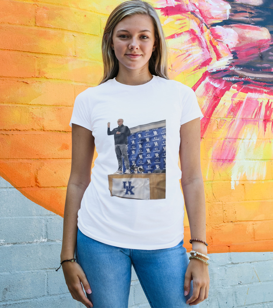 UK Volleyball Coach Craig Skinner Standing On Table With UK Logo And Awards T-Shirt