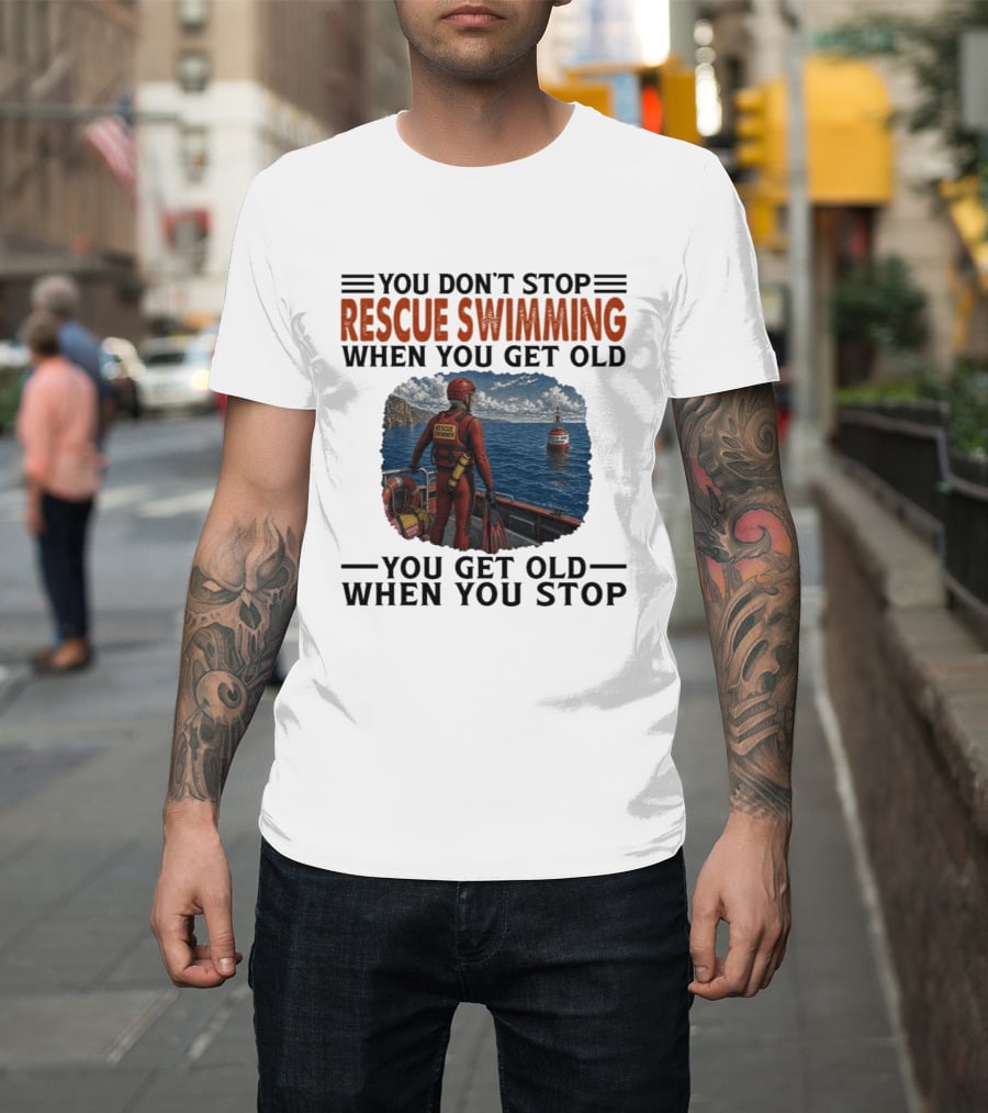 You Don't Stop Rescue Swimming When You Get Old You Get Old When You Stop Rescue Swimmer Standing On Boat Near Lighthouse T-Shirt