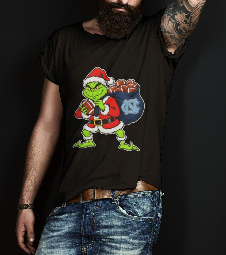Grinch Santa North Carolina Tar Heels Holding Chiefs Footballs Christmas T-Shirt