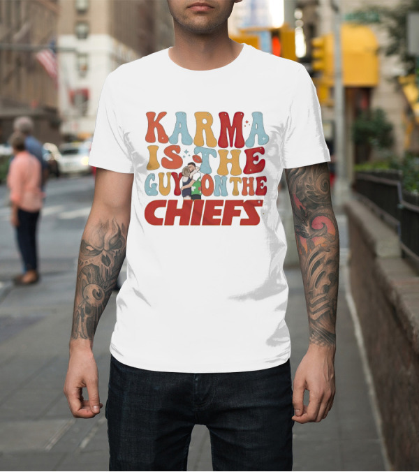 Shirt: Karma Is the Guy on the Chiefs Kelce Swift Hugging Football T-Shirt Karma Is the Guy on the Chiefs Kelce Swift Hugging Football T-Shirt