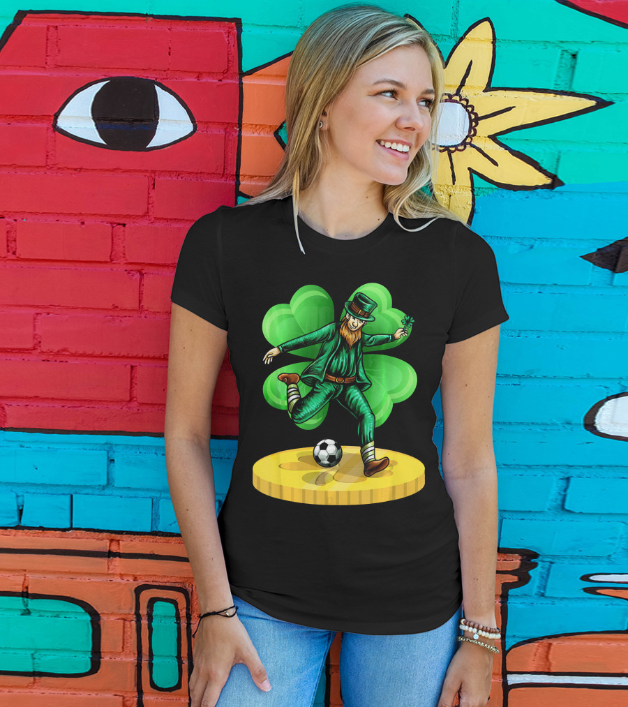 Leprechaun Kicking Soccer Ball On Gold Coin With Shamrock Background T-Shirt