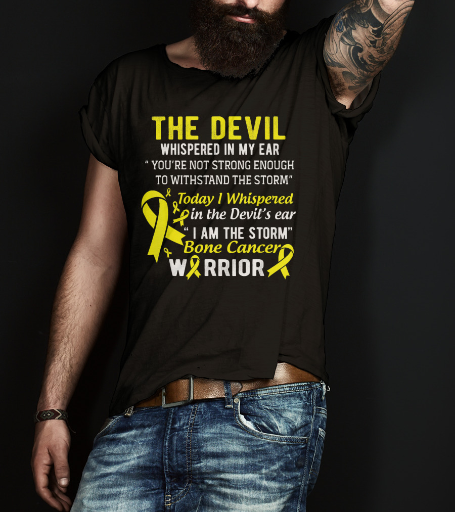 The Devil Whispered You’re Not Strong Enough To Withstand The Storm I Am The Storm Bone Cancer Warrior Yellow T-Shirt