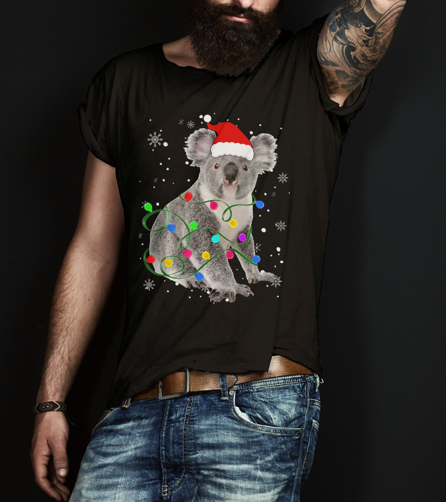 Koala Wrapped In Christmas Lights Wearing Santa Hat With Snowflakes Matching Fam T-Shirt