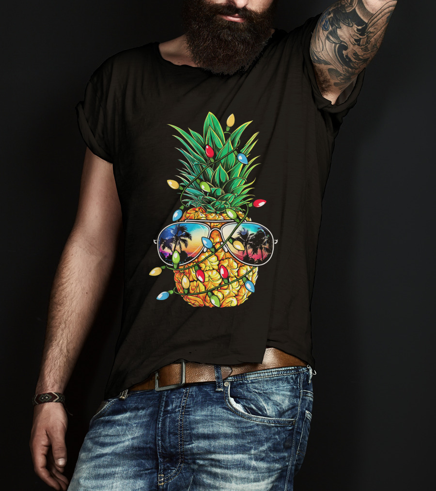 Pineapple Wrapped In Christmas Lights With Sunglasses Reflected Sunset And Palm Trees T-Shirt