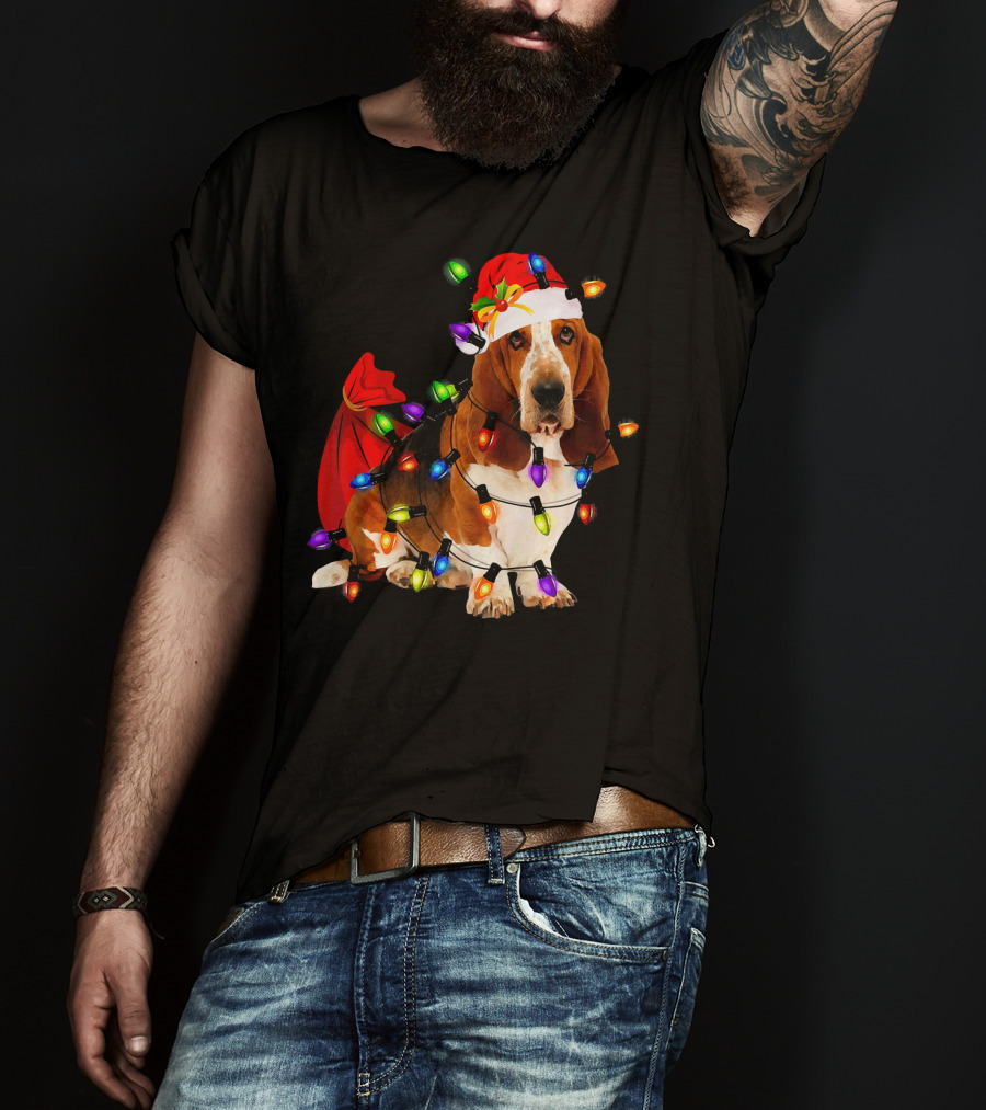 Basset Hound Wrapped In Christmas Lights With Santa Hat And Red Sack T-Shirt