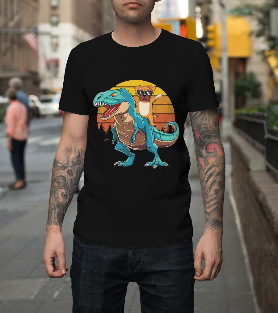 Boxer Dog With Sunglasses Riding Blue T-Rex Against Sunset Background T-Shirt